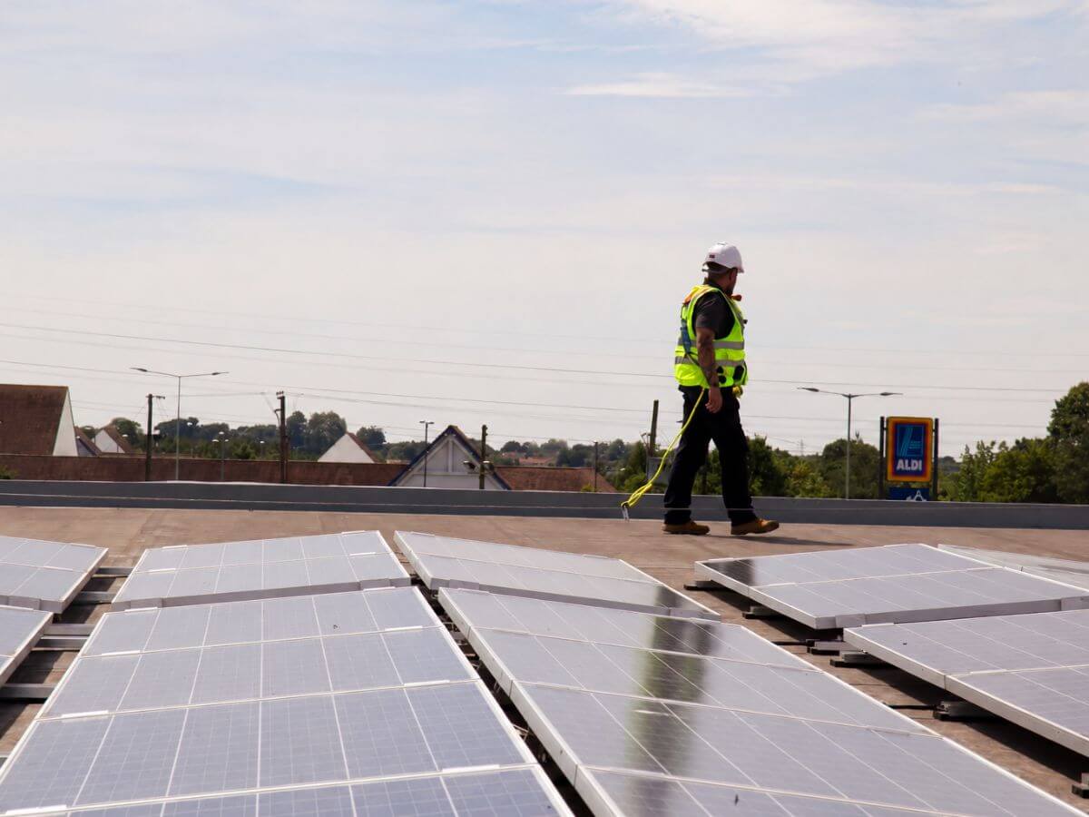 Commercial solar panel cleaning carried out on a large rooftop solar installation in Suffolk.