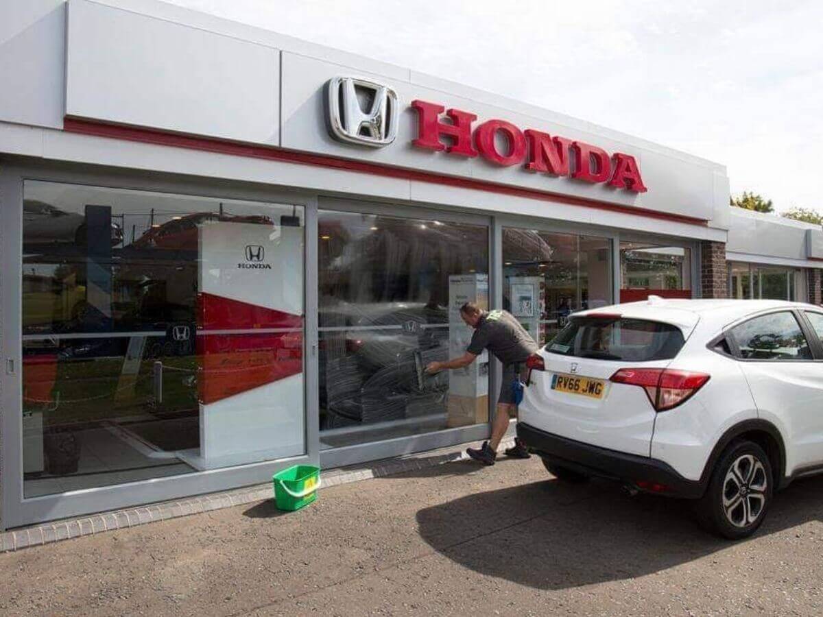 TLC Window Cleaning carrying out commercial window cleaning at a Honda dealership in Suffolk