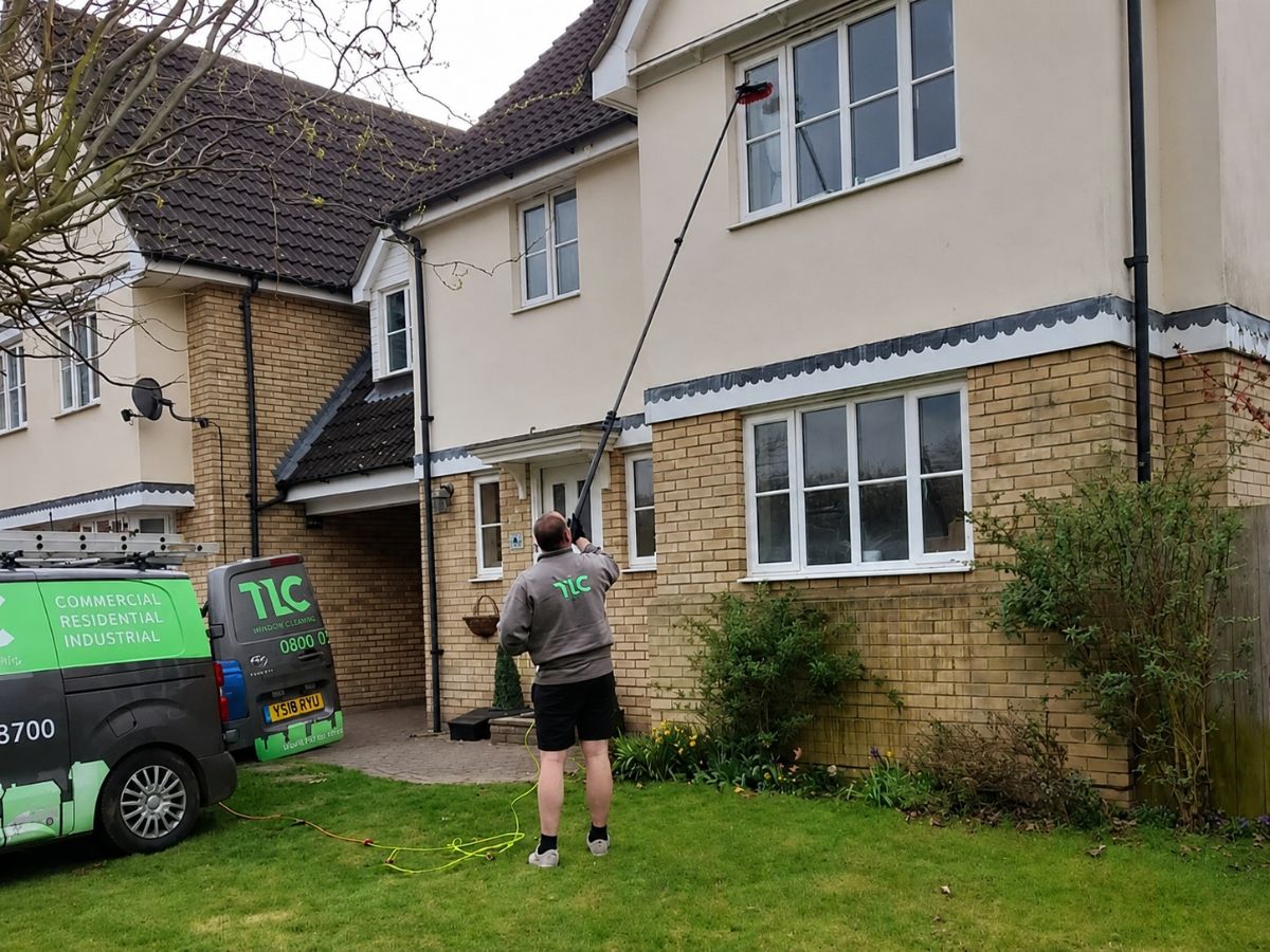 TLC Window Cleaner providing professional window cleaning services at a residential property in Suffolk.