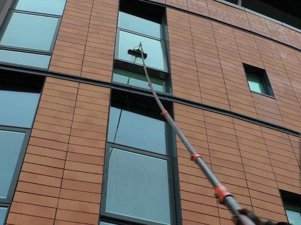 Modern apartment building with floor-to-ceiling glass windows professionally cleaned