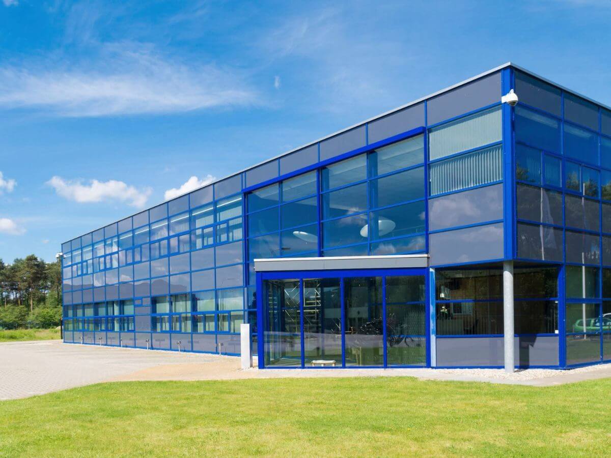 Modern commercial office building with large glass windows maintained by professional window cleaning services.