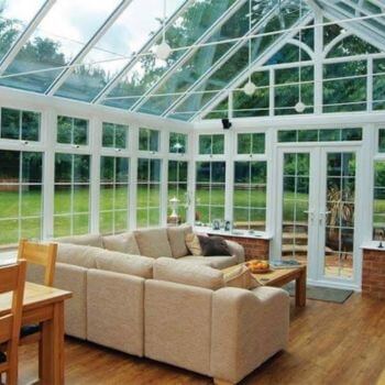 Bright conservatory with professionally cleaned glass and roof windows.