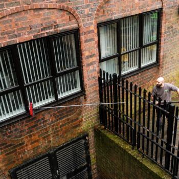 Professional window cleaning for flats and apartment block windows using a water fed pole system