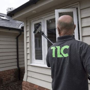 TLC Window Cleaning operative cleaning windows at a holiday let property.
