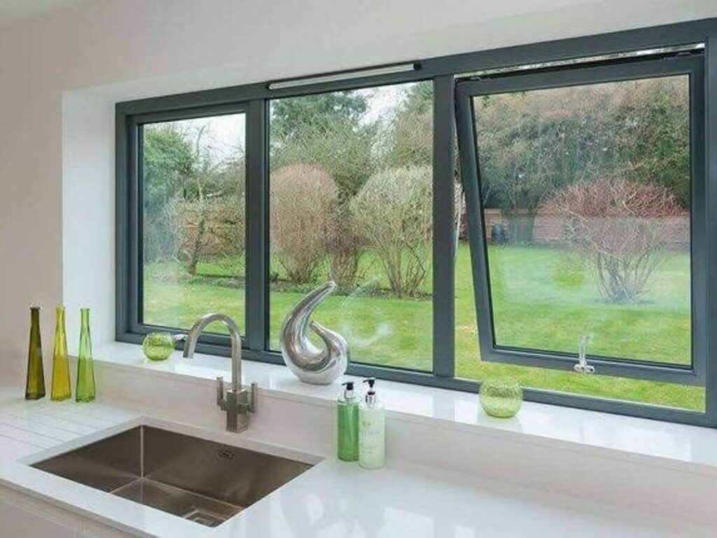 Large residential windows overlooking a garden after professional cleaning