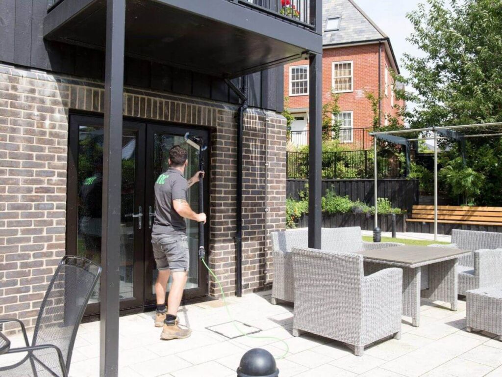 Modern residential property with large glass patio doors and clean exterior cleaning