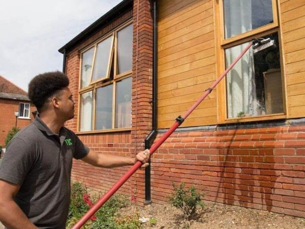 Window Cleaner using a water fed pole to clean residential windows