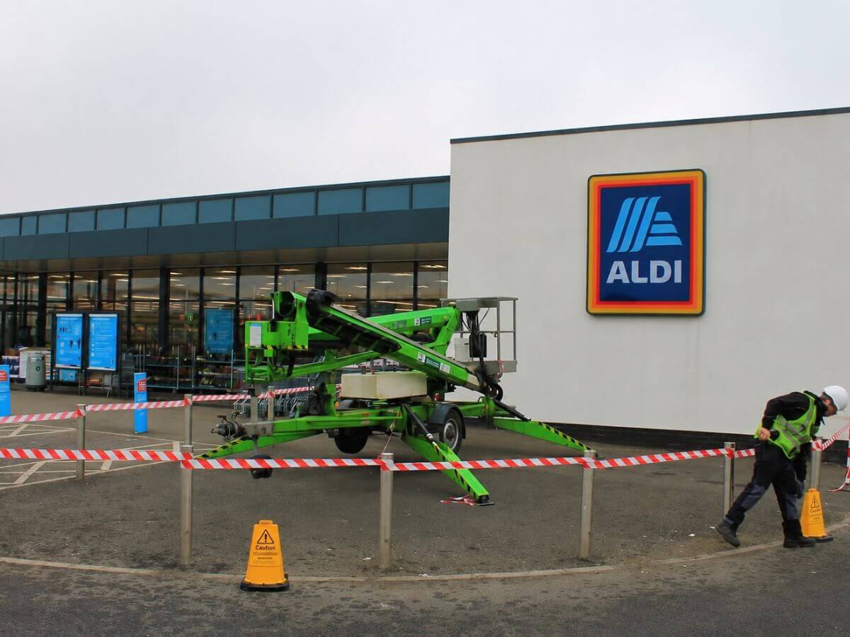 Commercial exterior cleaning at an ALDI supermarket using specialist access equipment for high-level cleaning and property maintenance.