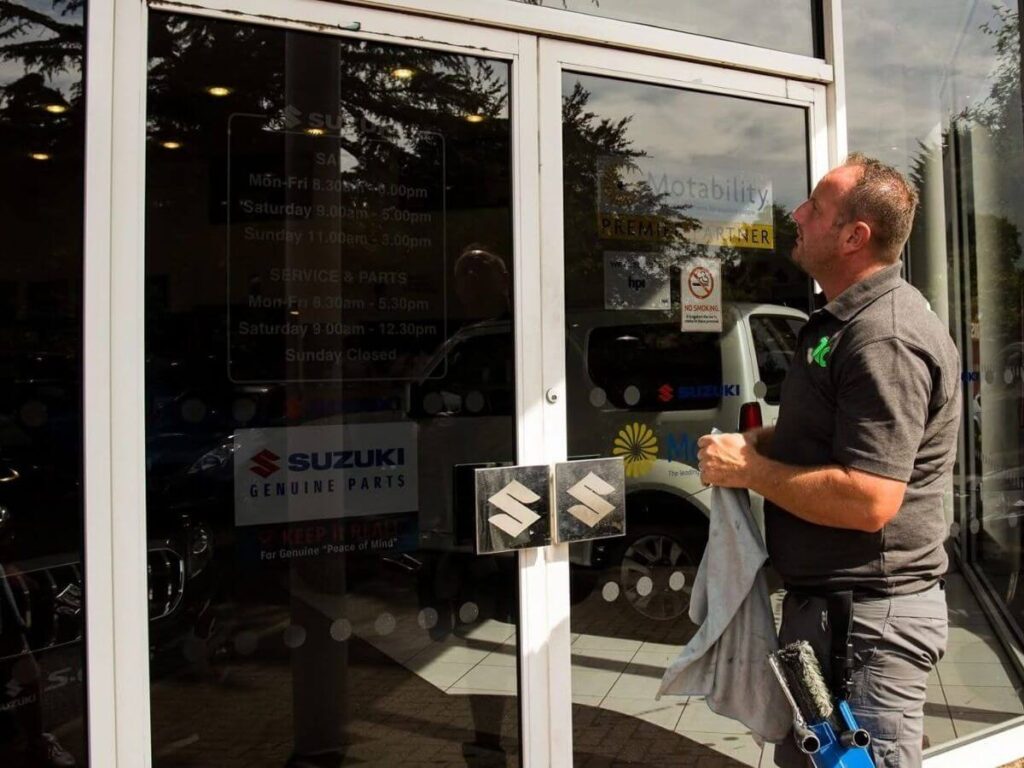 Commercial shopfront window cleaning in progress