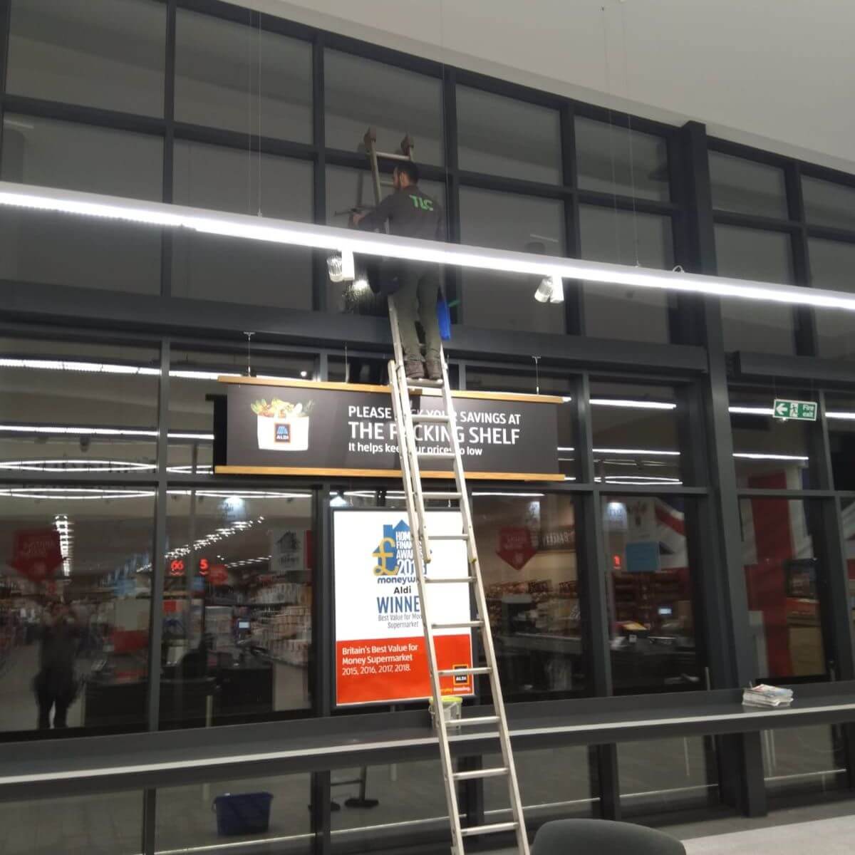 Commercial window cleaning at a retail shopfront by TLC Window Cleaning.