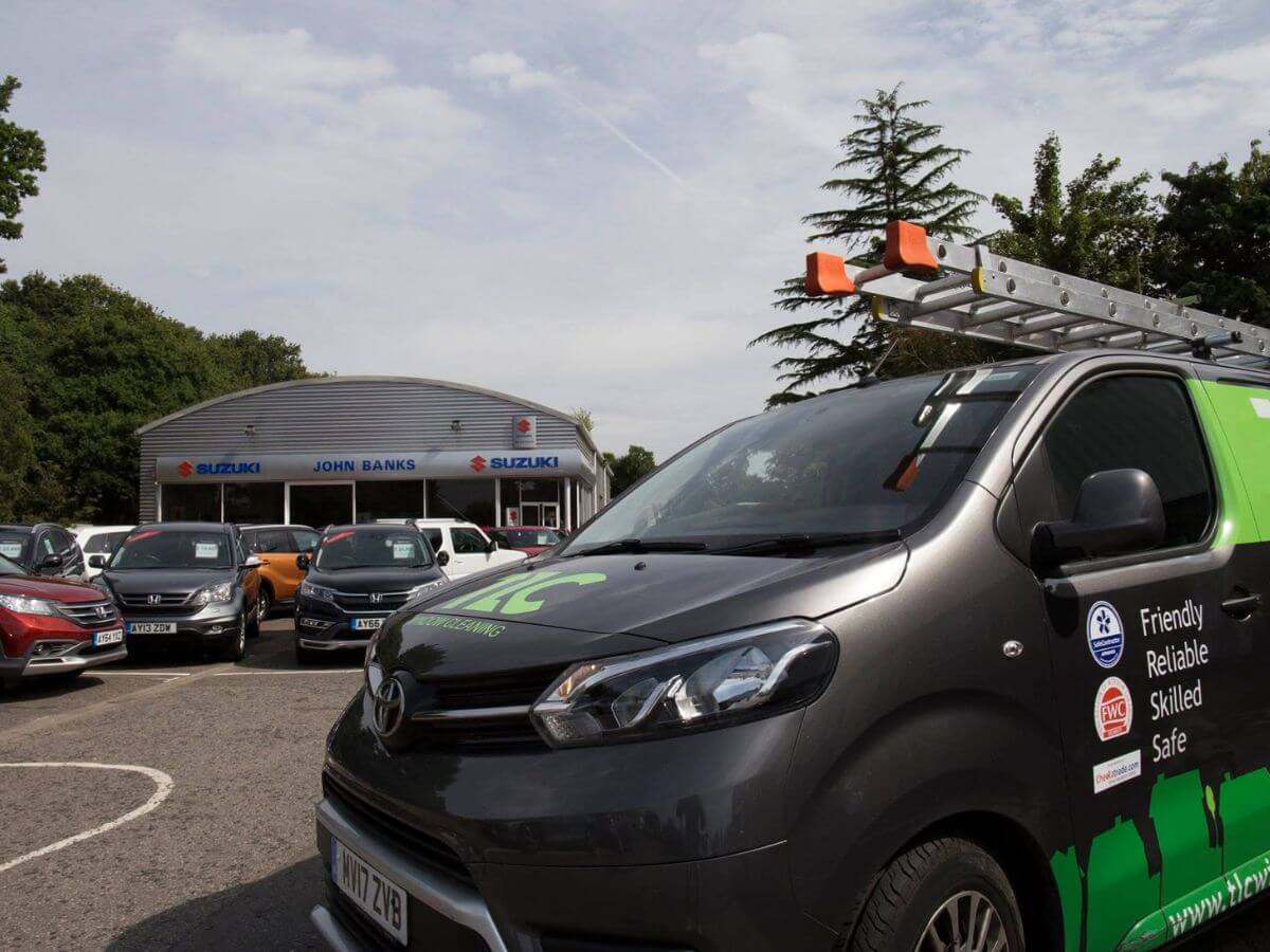 TLC Window Cleaning commercial service vehicle on-site at a client premises
